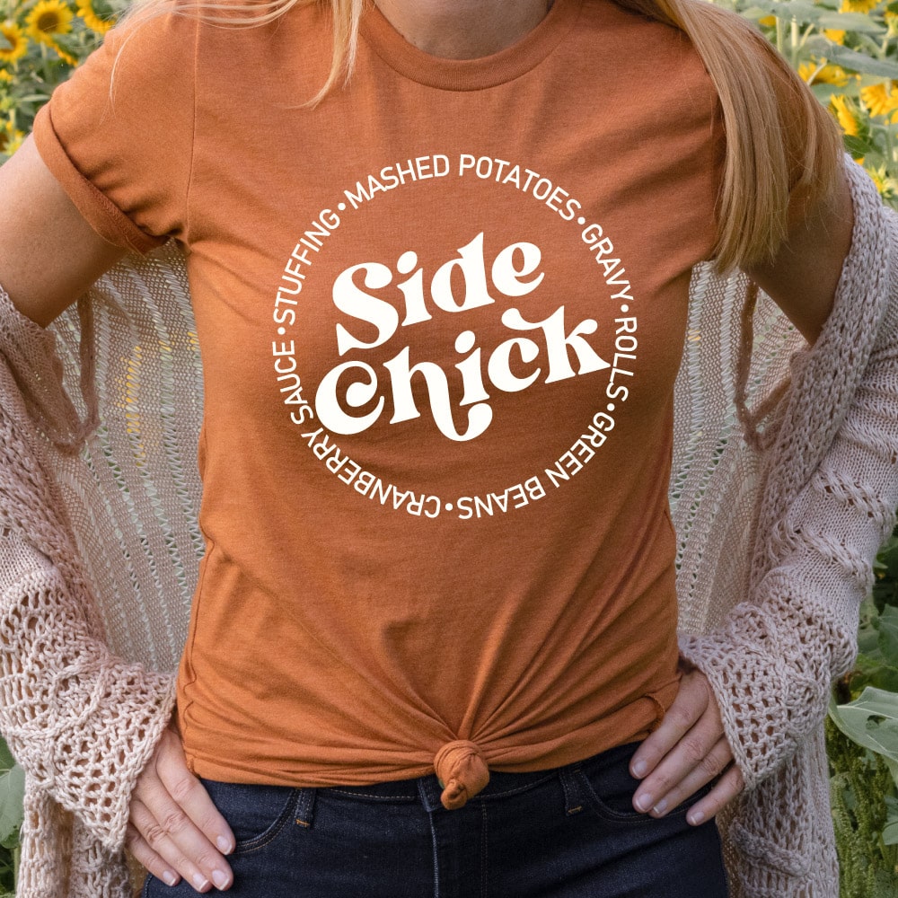 woman wearing an Autumn Orange T-shirt with the Side Chick design in white iron-on in square format