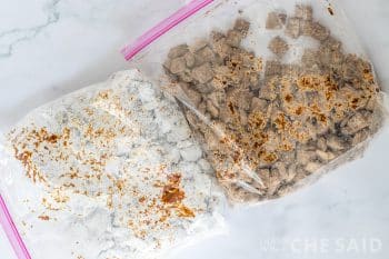 Chocolate coated cereal added to gallzon size zip bags, one with powdered sugar, the other with brownie mix