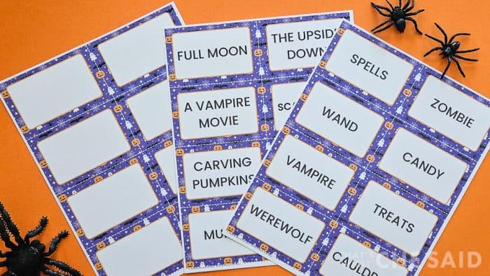 Halloween Charade cards printed on cardstock on orange background with spiders