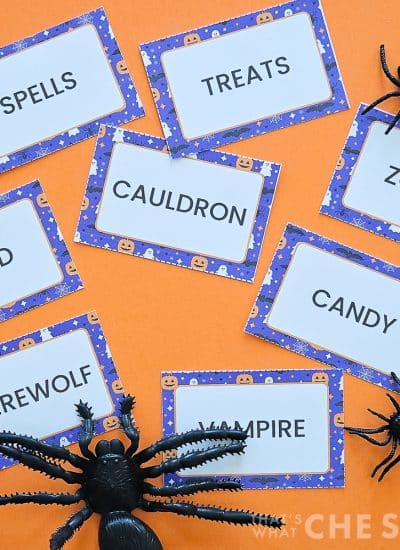 Halloween Printable Charade Game Cards on orange background with spiders in square format