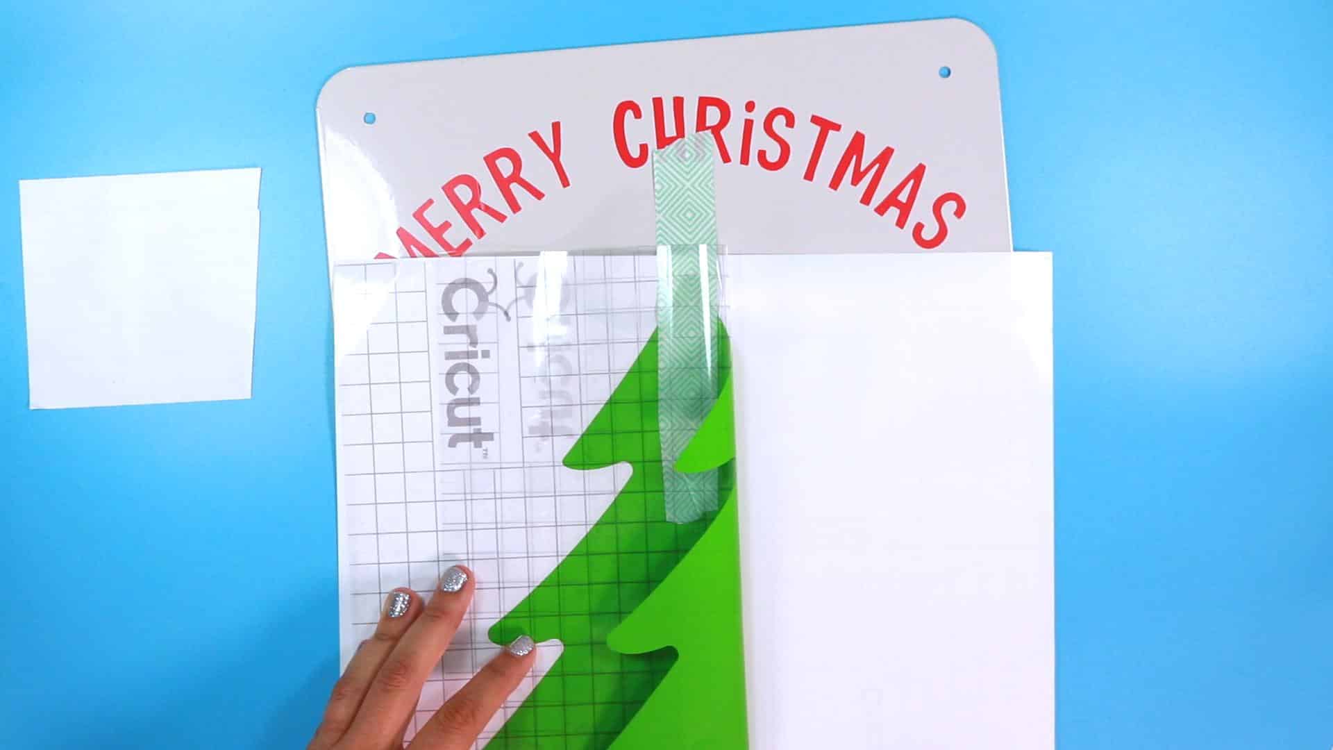 Using the Hinge method to apply adhesive vinyl for christmas tree on advent calendar