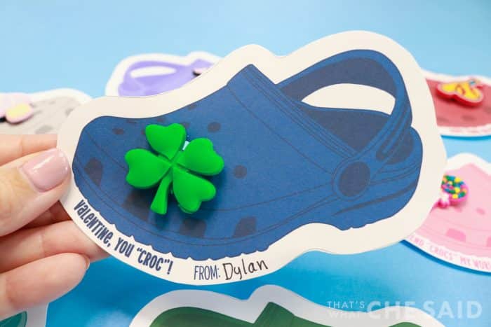 Close up of blue crocs valentine with shamrock jibitz attached