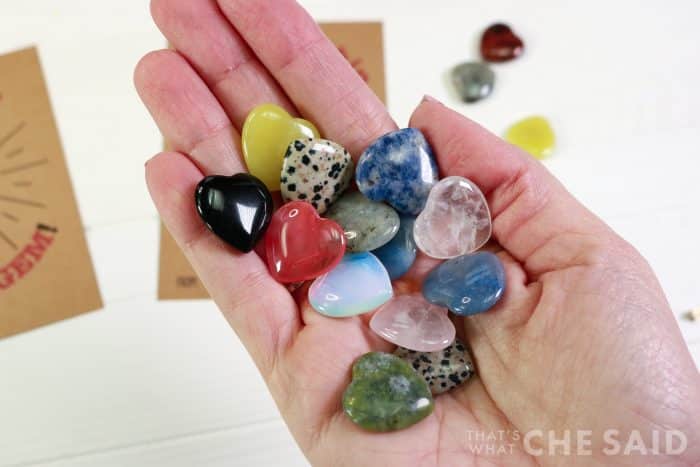 Close up of heart gemstones in palm of hand