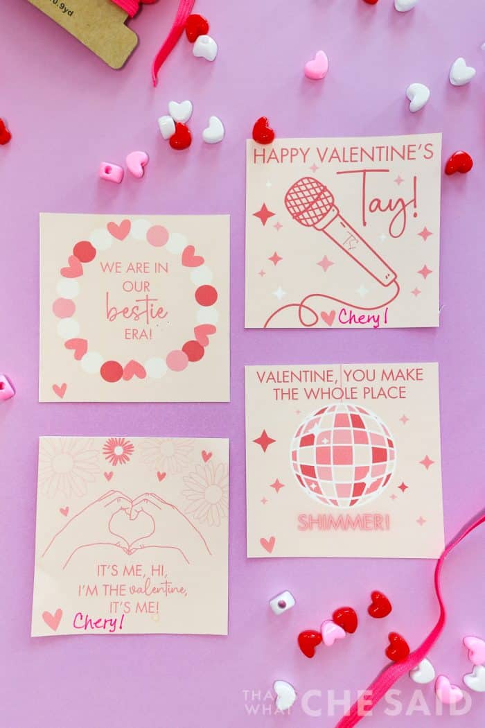 Taylor Swift Valentine Cards Free Printable. Cards cut apart laying on purple background
