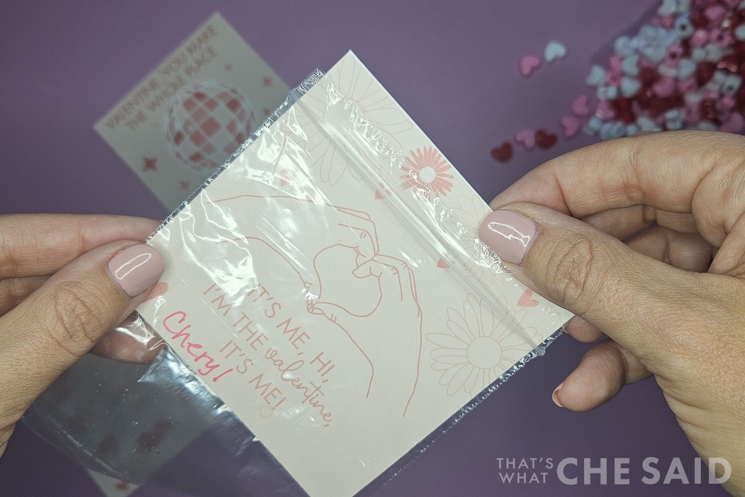 adding valentine card to bag