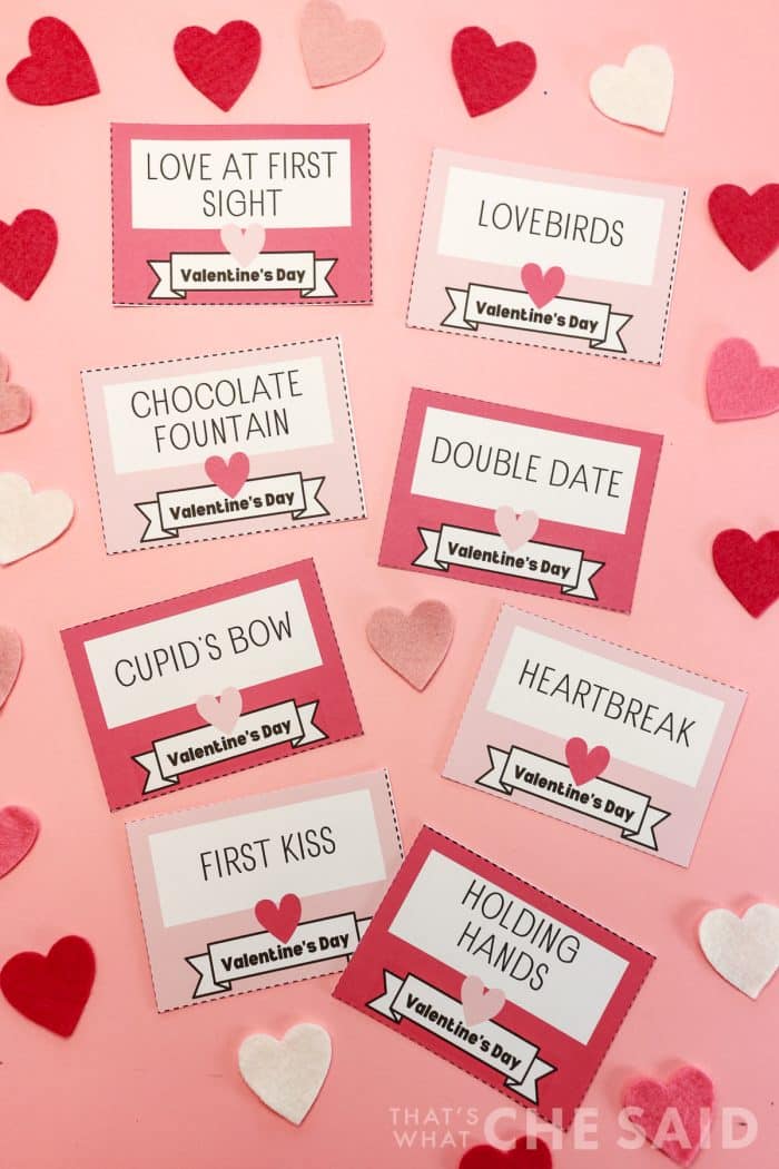 Valentine charades game cards cut apart on pink background - vertical