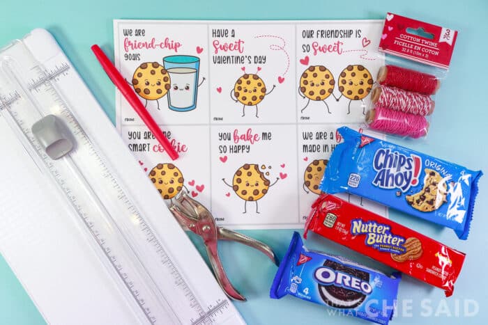Supplies for Cookie Valentines - Free printable, pen, twine, paper cuttter, hole punch and cookie packs