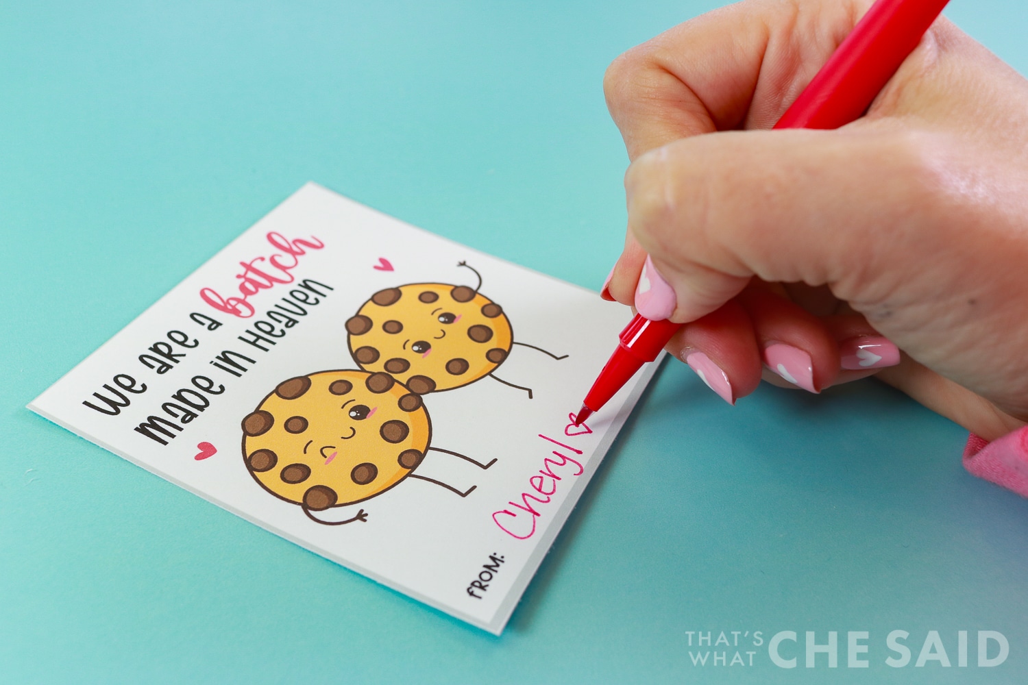 Signing name to free printable valentine