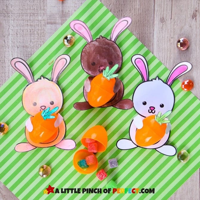 Paper bunnies holding plastic eggs