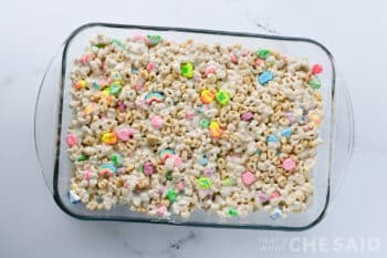 Lucky charms and marshamllow mixture pressed into a 9 x 13 pan