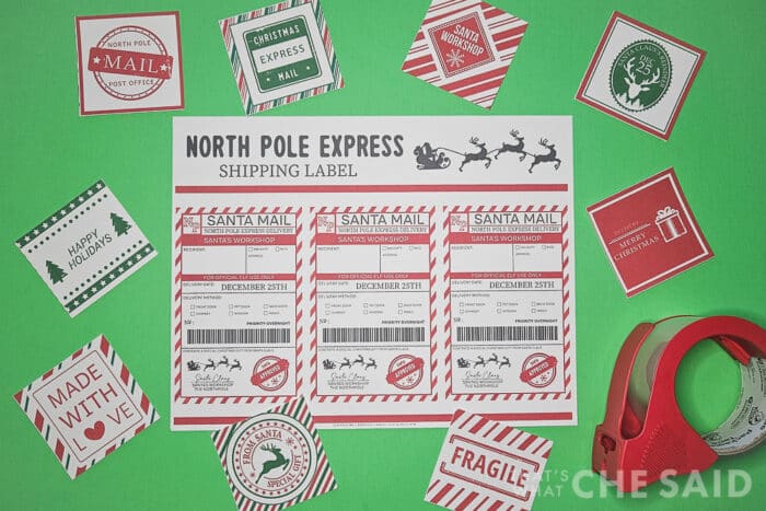 Printed North Pole shipping labels and stickers on green background