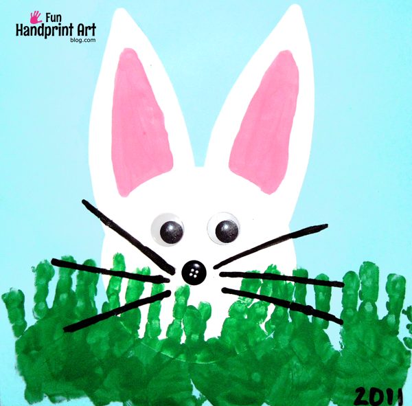 peeking bunny behind handprint grass