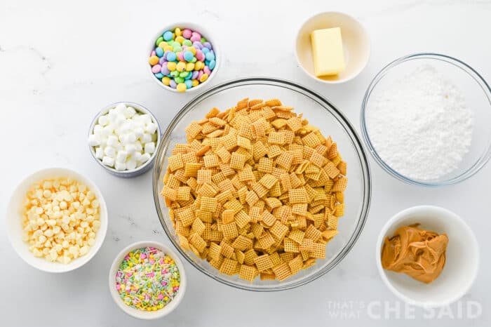 Easter Puppy chow ingredinets in bowls on a white countertop