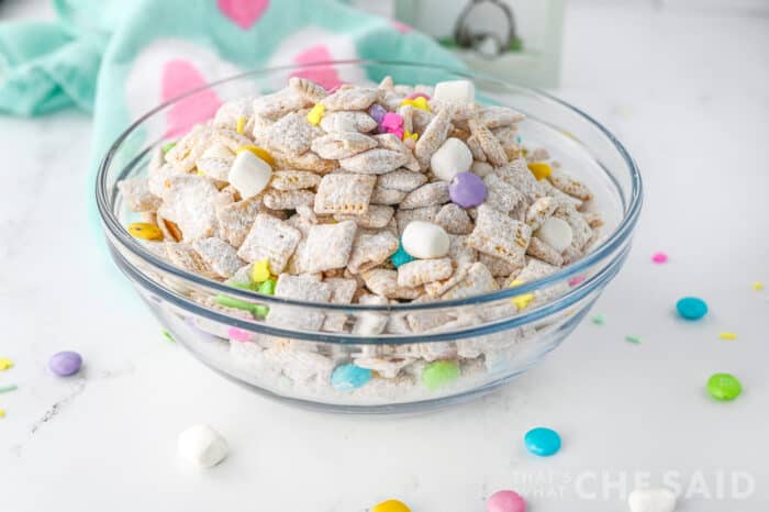 Easter puppy chow in glass bowl withe Easter fabric napkin - horizontal