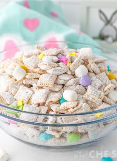 Easter puppy chow in glass bowl withe Easter fabric napkin - square