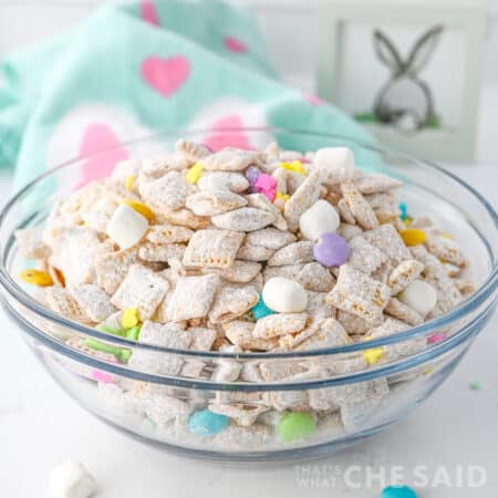 Easter puppy chow in glass bowl withe Easter fabric napkin - square