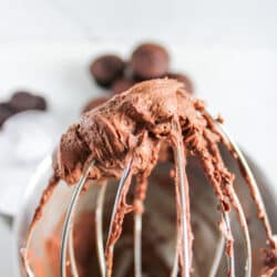 homemade chocolate buttercream frosting on a mixer whisk attachment