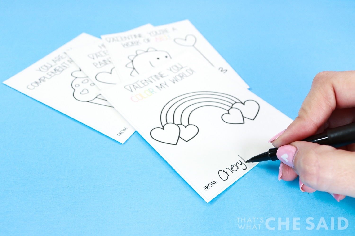 Signing the palette class valentines with a flair pen