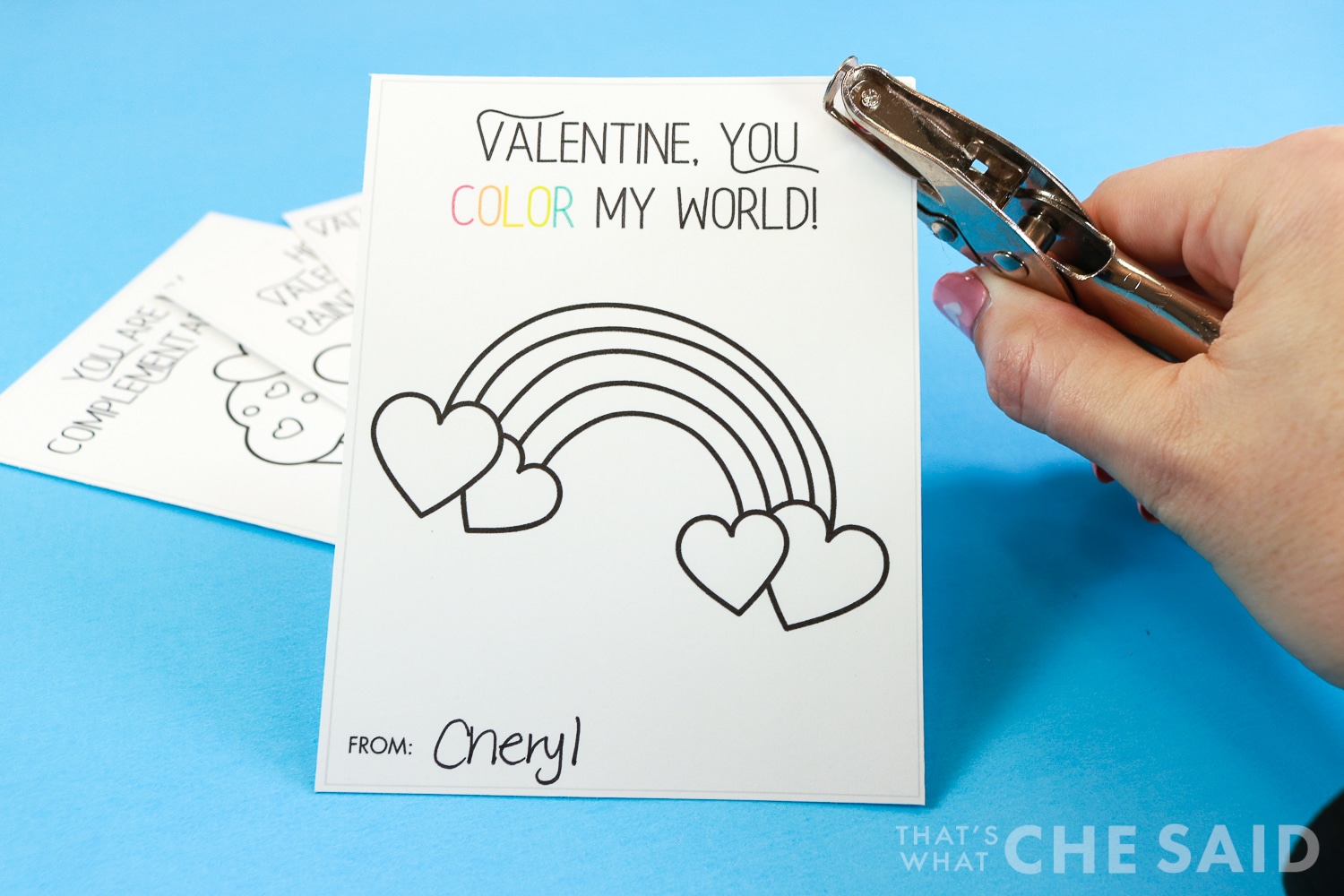 Punching a hole in the corner of the valentine