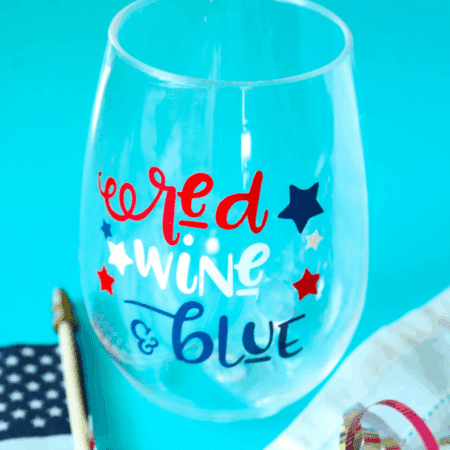 Red Wine and Blue wine decal on a wine glass with flag and blue background - square format