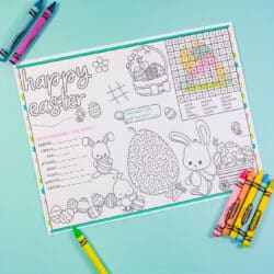 Vertical free printable easter placemat with crayons on aqua background