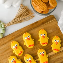 easter nutter butter chick cookies lined up on a bamboo serving dish