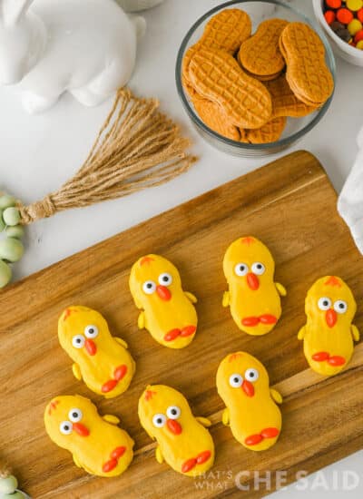 easter nutter butter chick cookies lined up on a bamboo serving dish