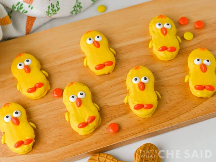 Nutter butter cookies dipped in yellow candy melts and decorated to appear as chicks for an easter treat