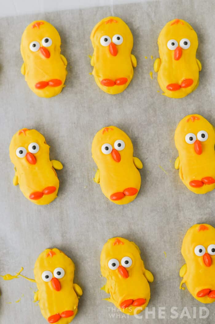 nutter butter chick cookies drying on a parchment lined baking sheet