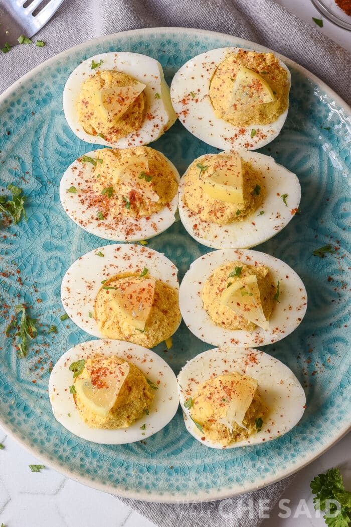 smokey deviled eggs on a blue plate