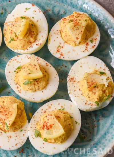 close up of deviled eggs with mini lemon wedges