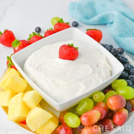 Cool Whip Fruit dip in a square dish with fruit around it, Square orientation