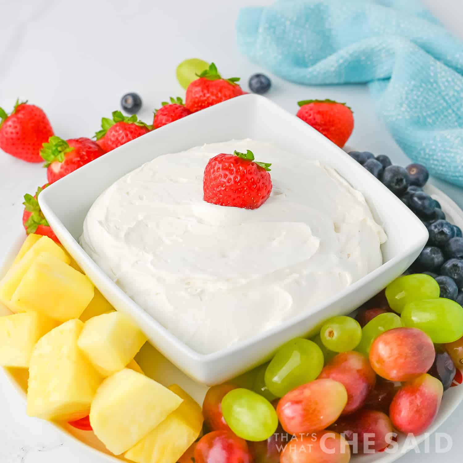 Cool Whip Fruit dip in a square dish with fruit around it, Square orientation