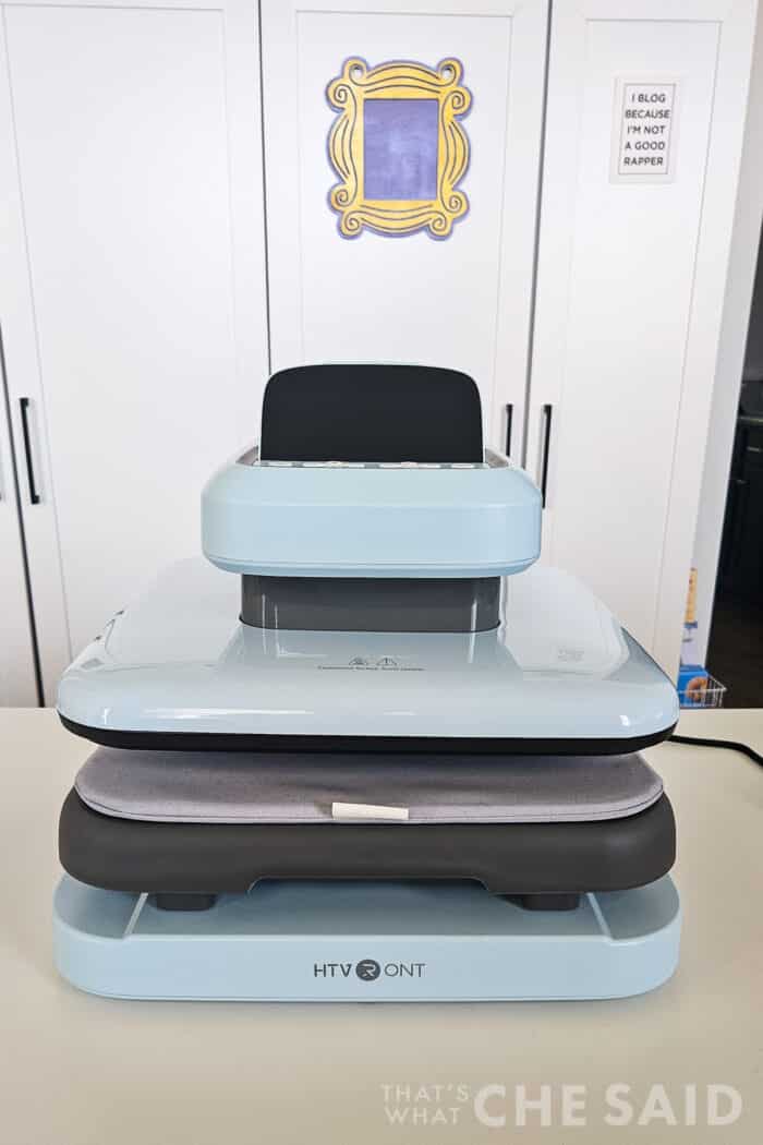 Front view of the HTVRont Auto Heat Press 2 sitting on a white table