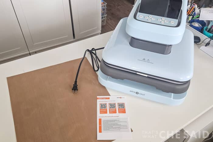 Contents of the box of the HTVRont Auto Heat Press 2 - the press, teflon sheet and instructions