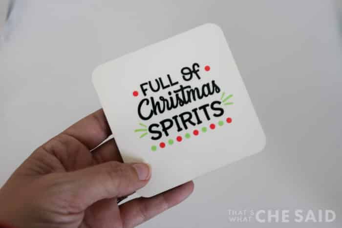 Sublimation coaster with the phrase "Full of Christmas Spirits"