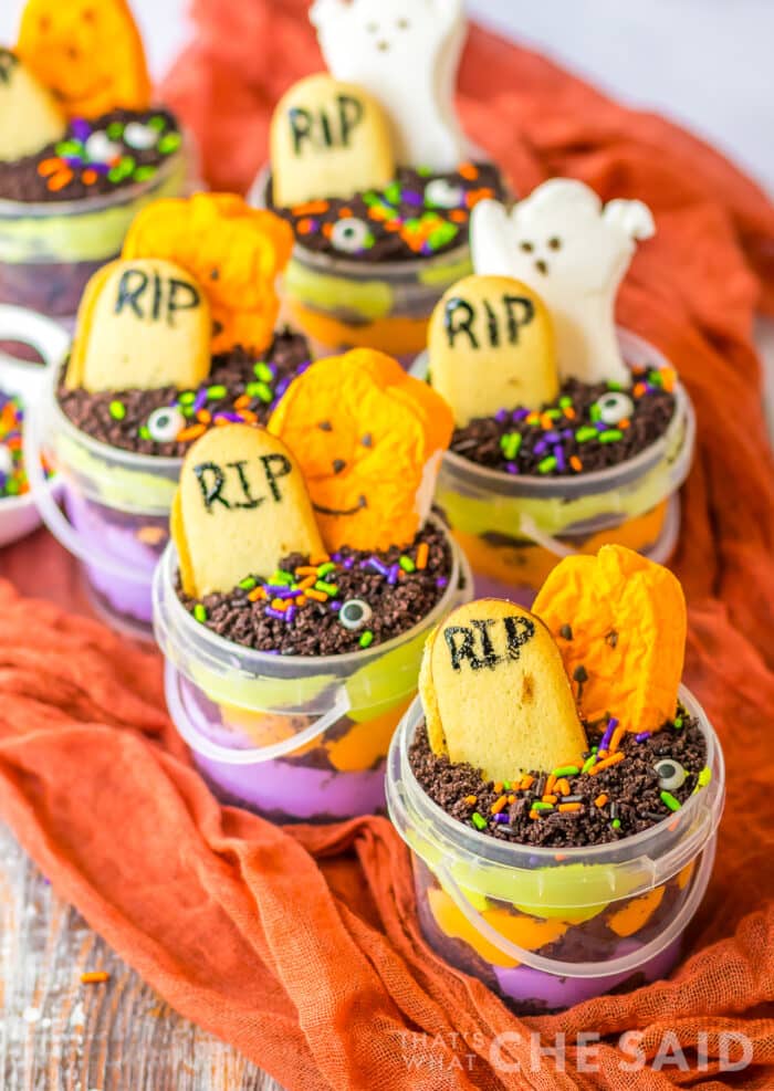 Many Graveyard treat cups lined up on a towel