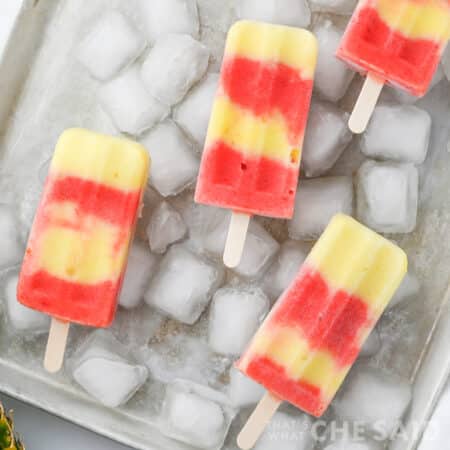 Lava flow popsicles on a tray of ice in square format
