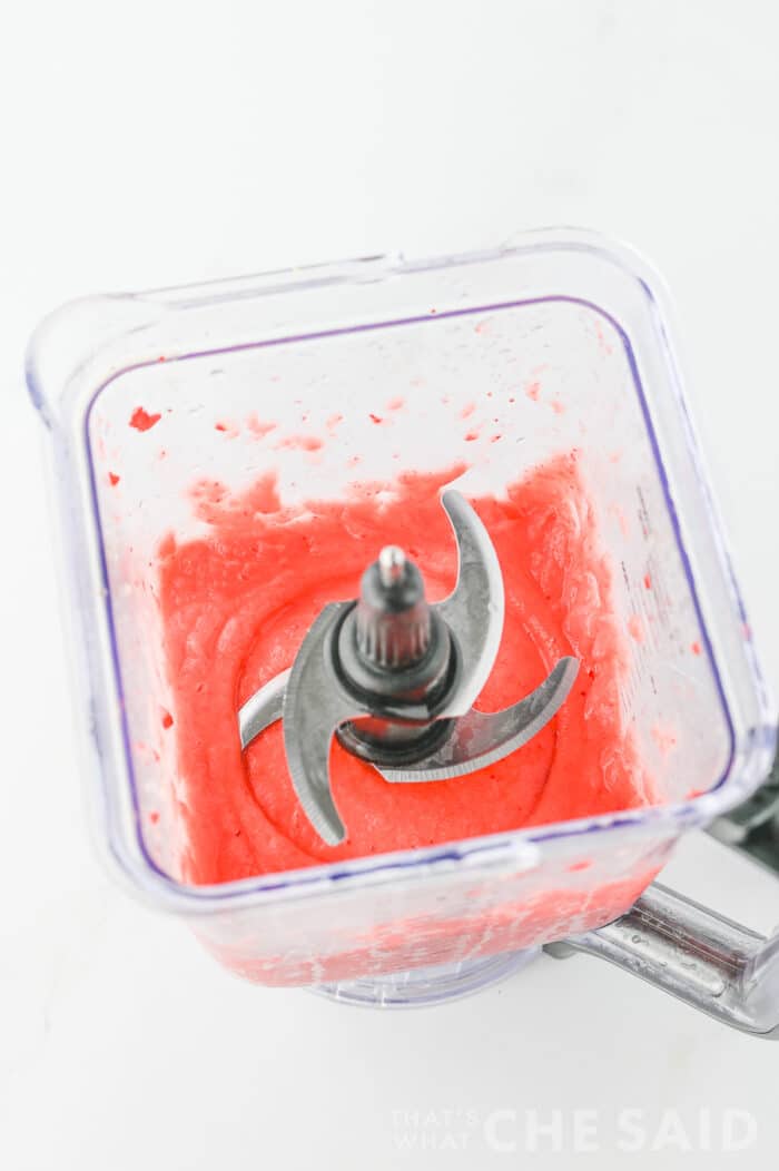Frozen strawberries blended in the blender