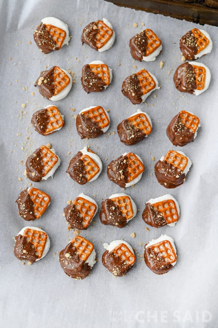 Smore Pretzel Bites on parchment lined baking sheet after chilling