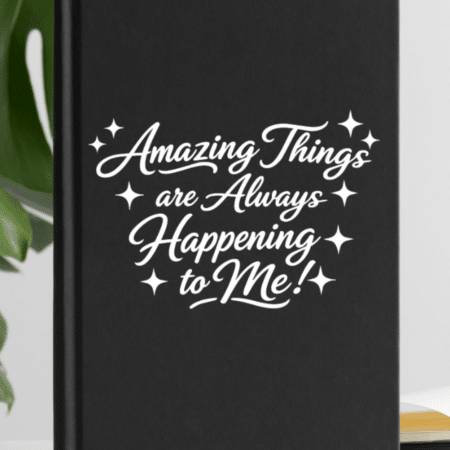 Black journal in front of a monstera plant with amazing things are always happening to me on front feature image 3x4