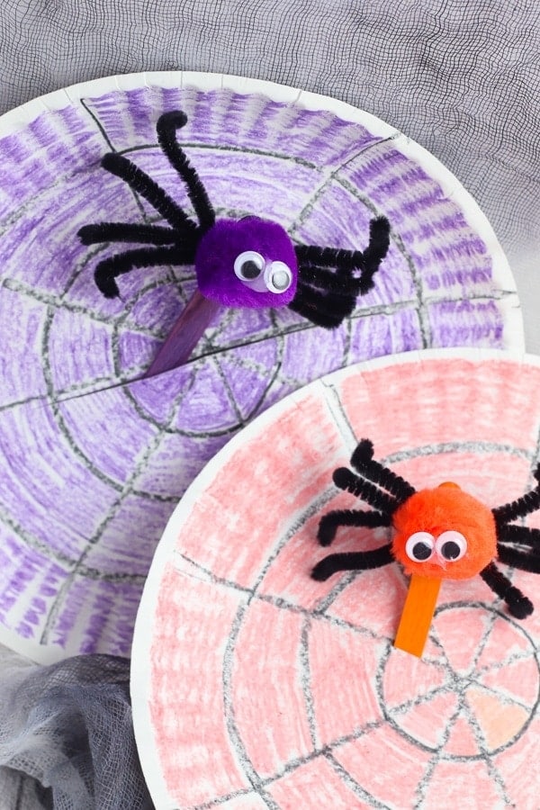 Paper plate spider webs with pom pom spiders